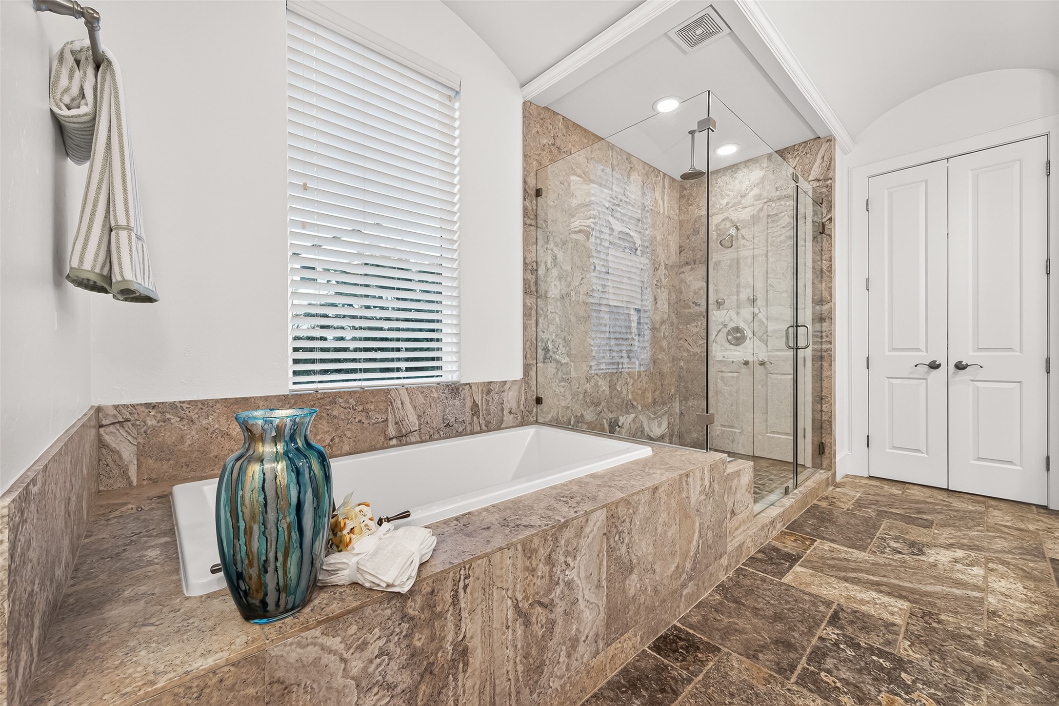1208 Welch Street Houston, TX 77006 - Photo 18 of 35 The large, relaxing soaking tub and enormous walk-in shower. With both a rain shower head and a wall-mounted head, showering will be blissful.