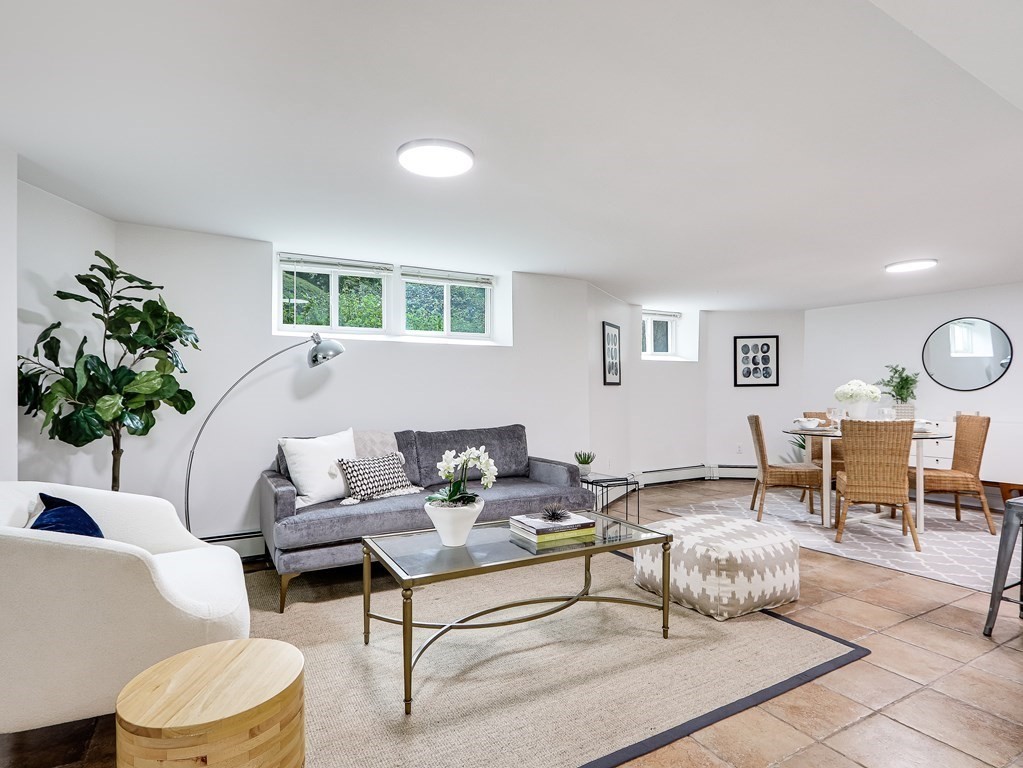 138 Middlesex Road, Unit B Newton, MA 02467 - Photo 5 of 16 a living room with furniture and a large window