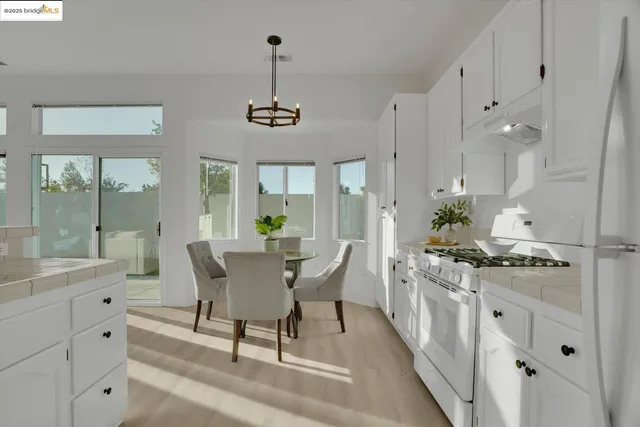 a view of a kitchen and dining room