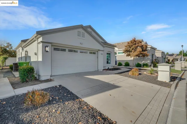 a view of the house with a yard