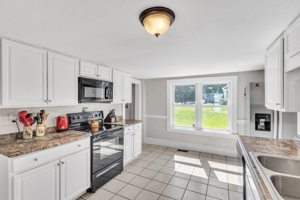 153 Pomeroy Meadow Road Southampton, MA 01073 - Photo 16 of 42 a kitchen that has a sink and a stove top oven
