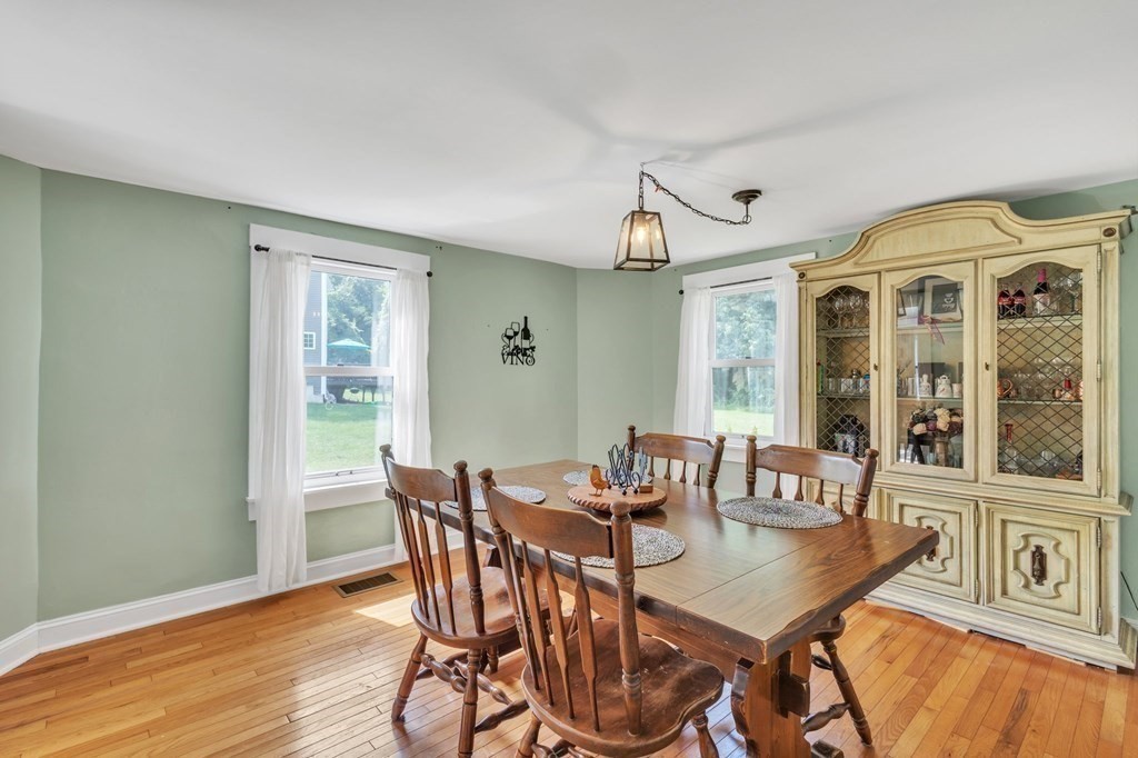 153 Pomeroy Meadow Road Southampton, MA 01073 - Photo 19 of 42 a view of a dining room with furniture window and wooden floor