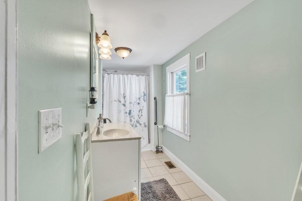 153 Pomeroy Meadow Road Southampton, MA 01073 - Photo 34 of 42 a bathroom with a sink and a mirror