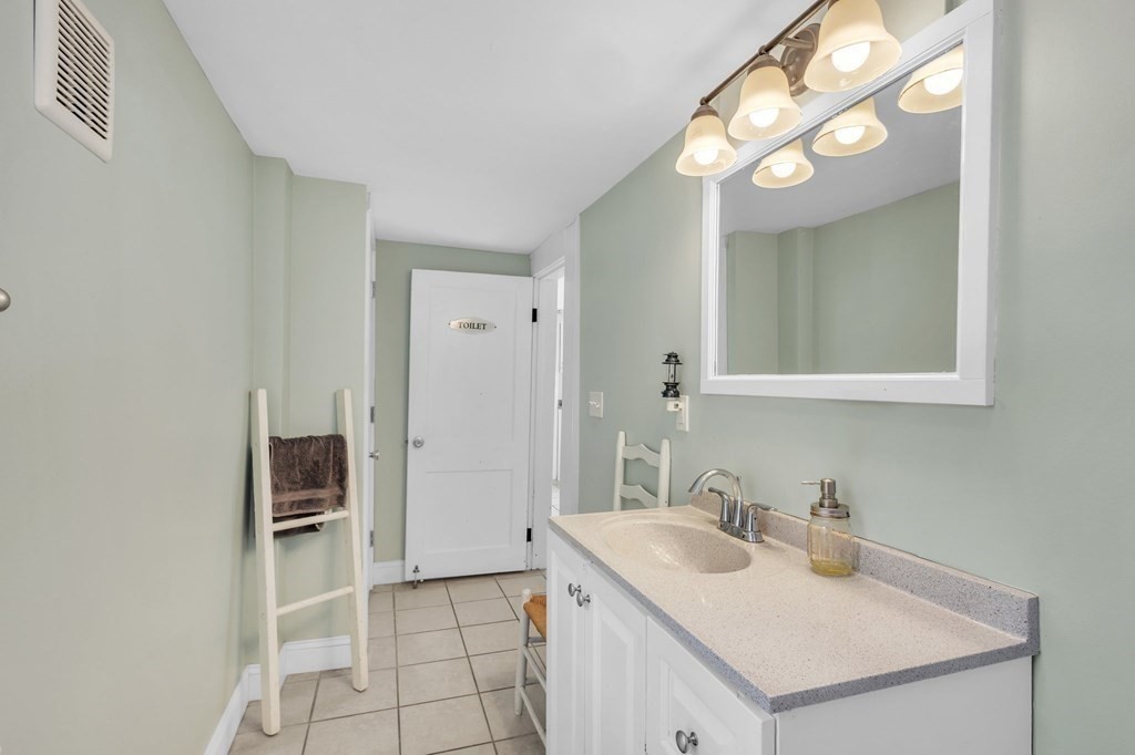 153 Pomeroy Meadow Road Southampton, MA 01073 - Photo 35 of 42 a bathroom with a sink and a mirror