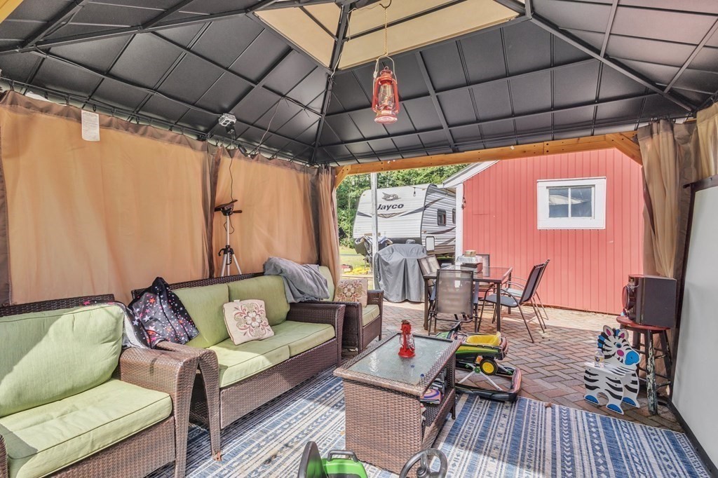 153 Pomeroy Meadow Road Southampton, MA 01073 - Photo 39 of 42 a building outdoor space with patio furniture