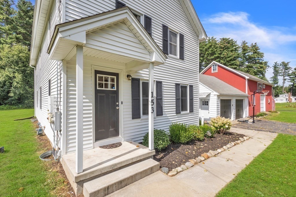 153 Pomeroy Meadow Road Southampton, MA 01073 - Photo 4 of 42 a front view of a house with a garden