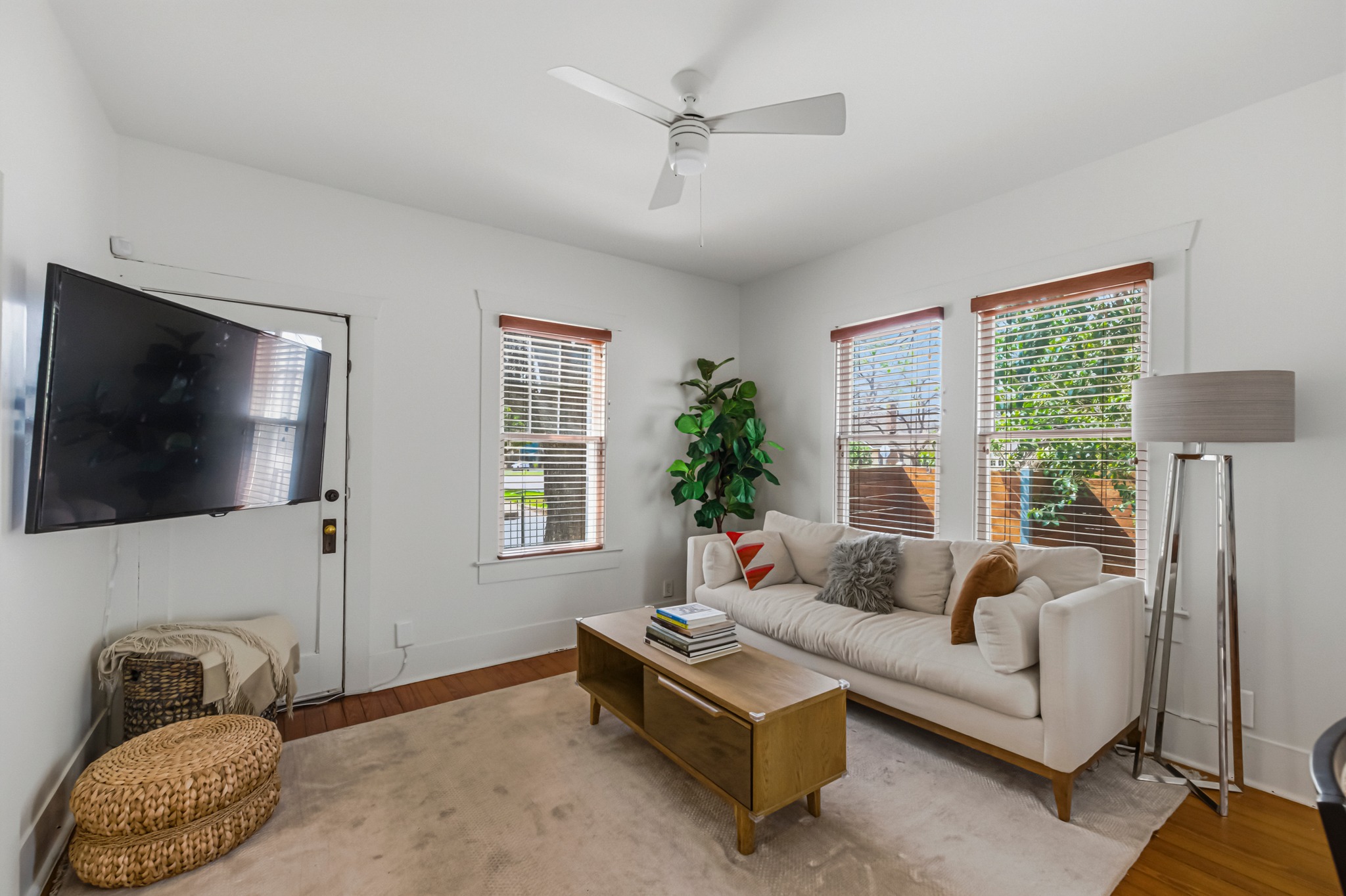306 West 44th Street, Unit A Austin, TX 78751 - Photo 11 of 38 a living room with furniture and a flat screen tv