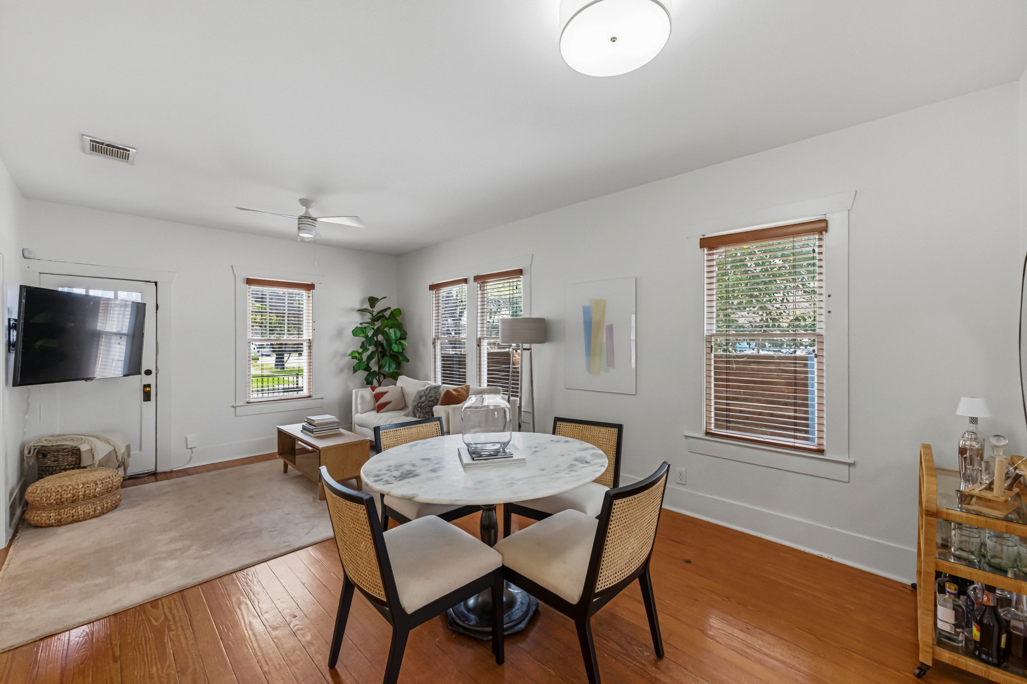 306 West 44th Street, Unit A Austin, TX 78751 - Photo 15 of 38 a view of a dining room with furniture window and wooden floor
