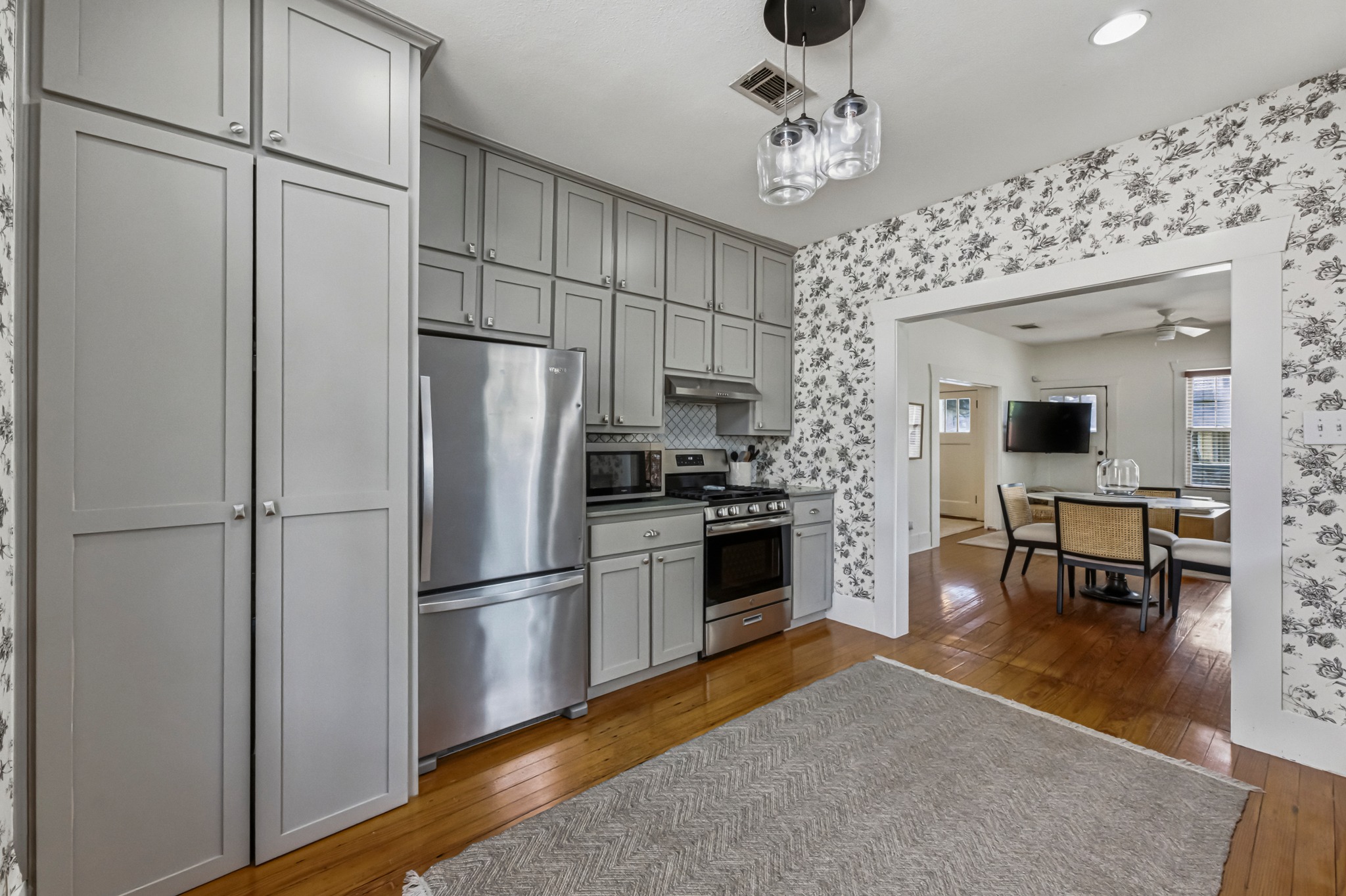306 West 44th Street, Unit A Austin, TX 78751 - Photo 20 of 38 a kitchen with stainless steel appliances a refrigerator and a stove top oven