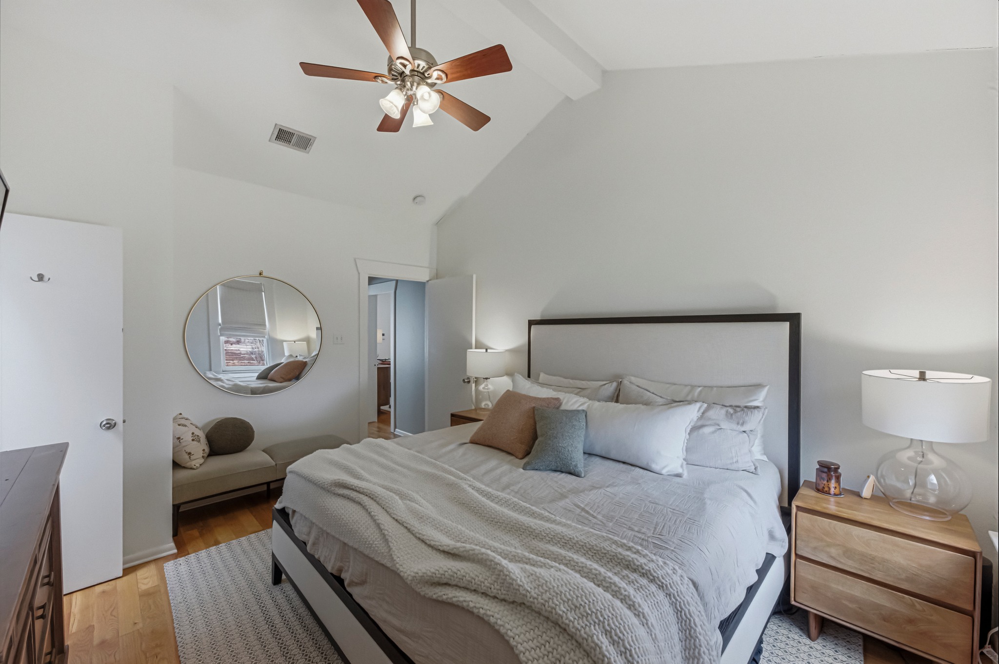 306 West 44th Street, Unit A Austin, TX 78751 - Photo 24 of 38 a bedroom with a bed mirror and a window