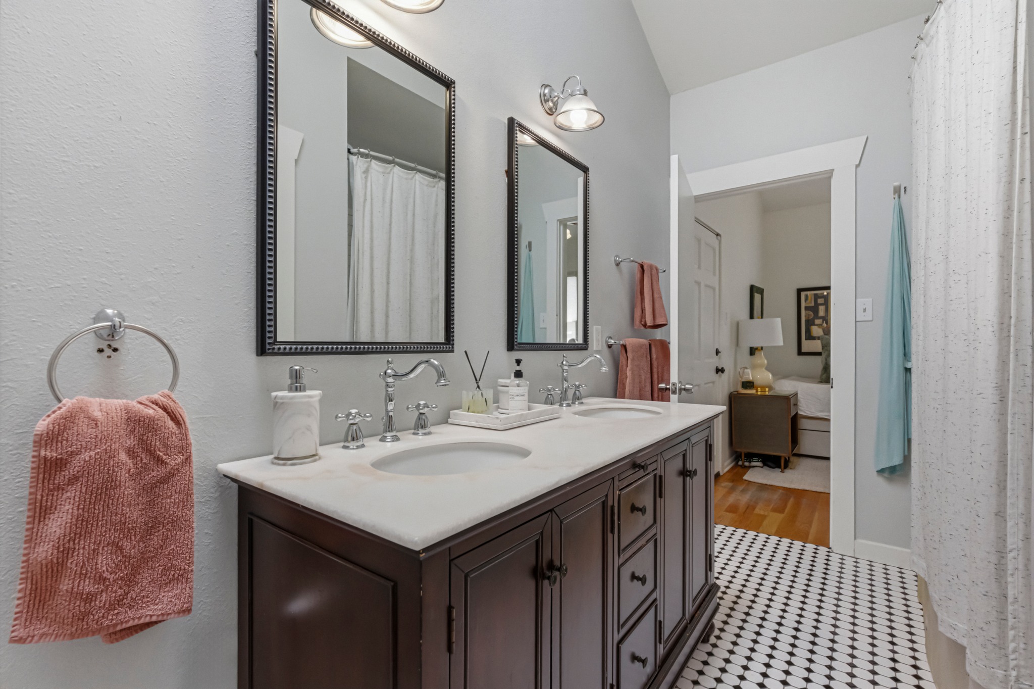 306 West 44th Street, Unit A Austin, TX 78751 - Photo 25 of 38 a bathroom with a sink and a mirror