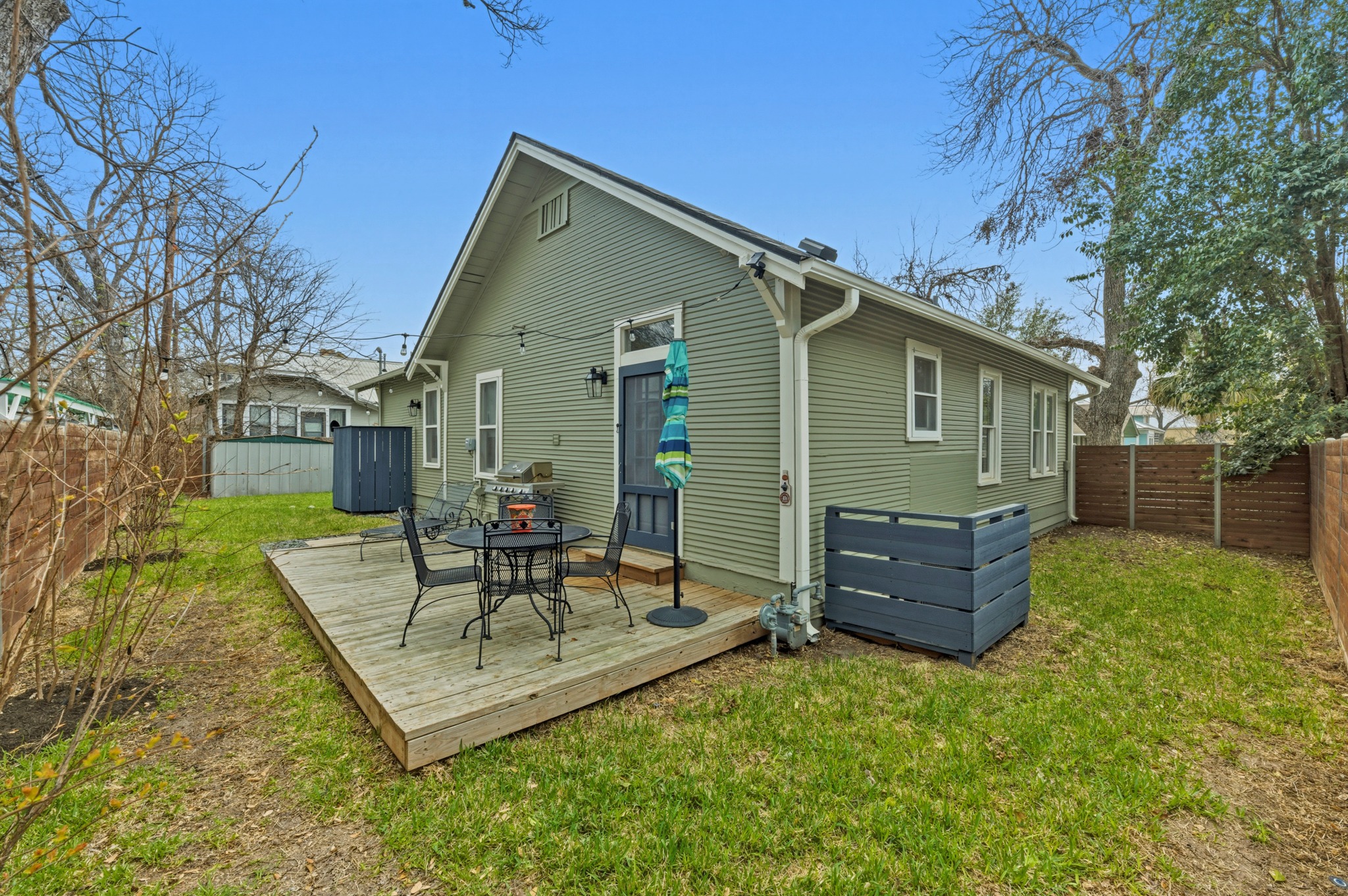 306 West 44th Street, Unit A Austin, TX 78751 - Photo 34 of 38 a view of a chair and table in backyard of the house