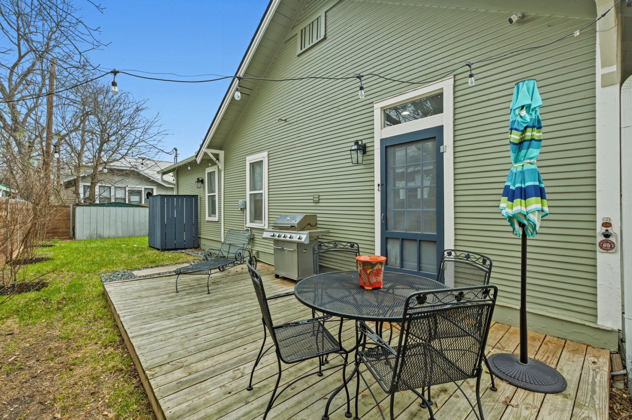 306 West 44th Street, Unit A Austin, TX 78751 - Photo 35 of 38 a view of a patio with table and chairs and a barbeque