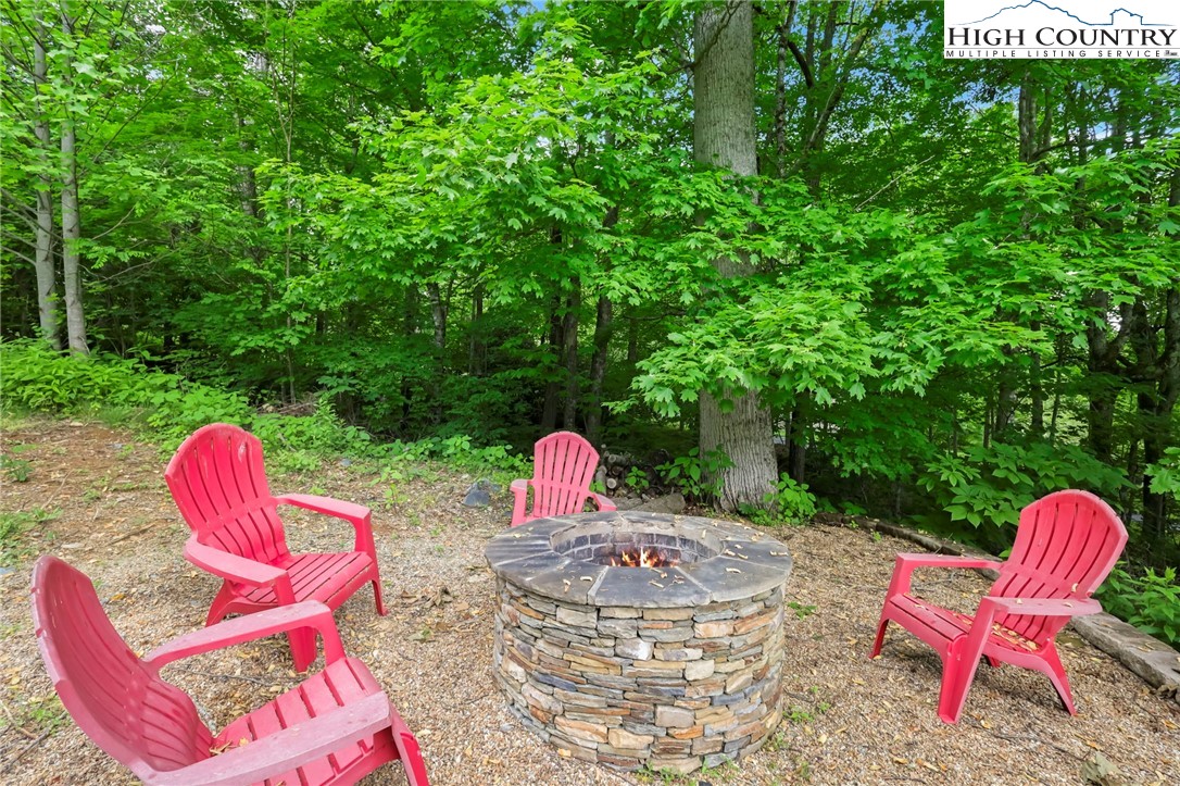 138 South Camp Road, Unit 103 Boone, NC 28607 - Photo 5 of 50 a view of swimming pool with a table and chairs