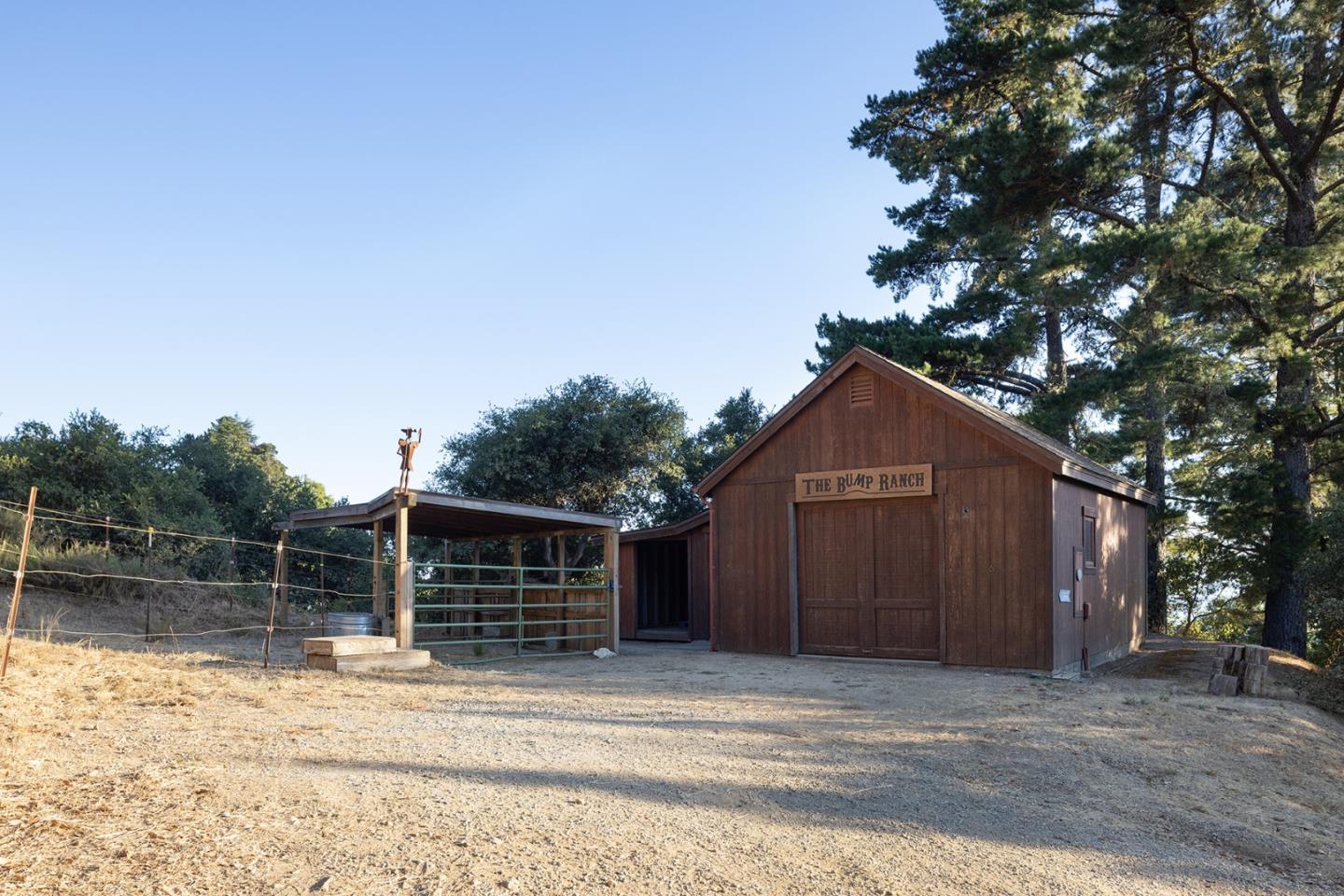 47600 Coast Ridge Road Big Sur, CA 93920 - Photo 34 of 36 a front view of a house with a yard and garage