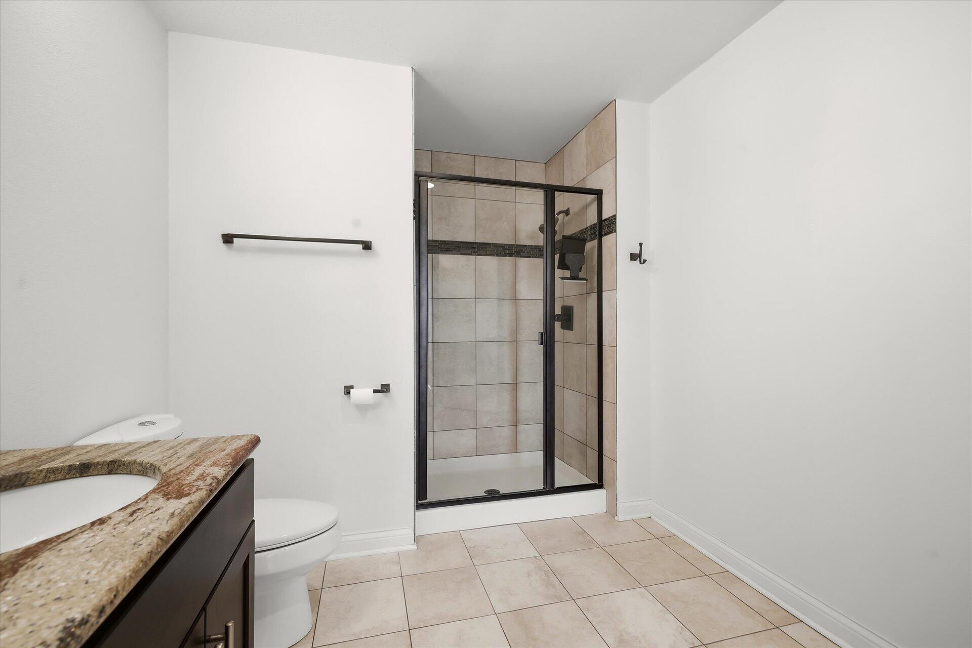 106 West Seeboth Street, Unit 920 Milwaukee, WI 53204 - Photo 22 of 51 Tiled Walk in shower