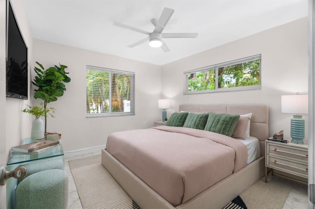 1502 Southwest 24th Street, Unit A Fort Lauderdale, FL 33315 - Photo 11 of 23 a bedroom with a large bed and a window