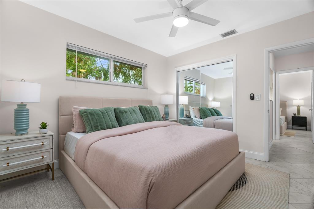 1502 Southwest 24th Street, Unit A Fort Lauderdale, FL 33315 - Photo 12 of 23 a bedroom with a large bed and a window