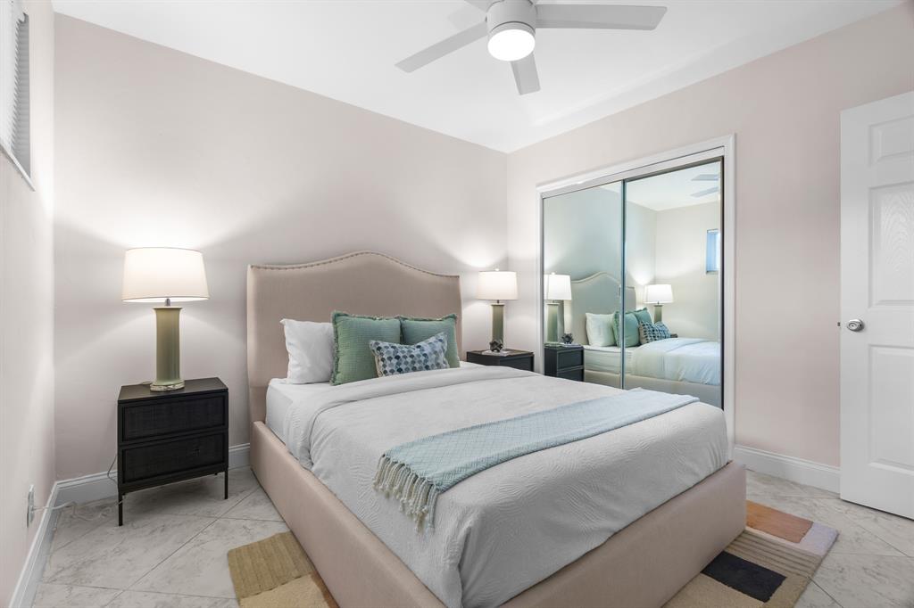 1502 Southwest 24th Street, Unit A Fort Lauderdale, FL 33315 - Photo 15 of 23 a bedroom with a bed and a lamp