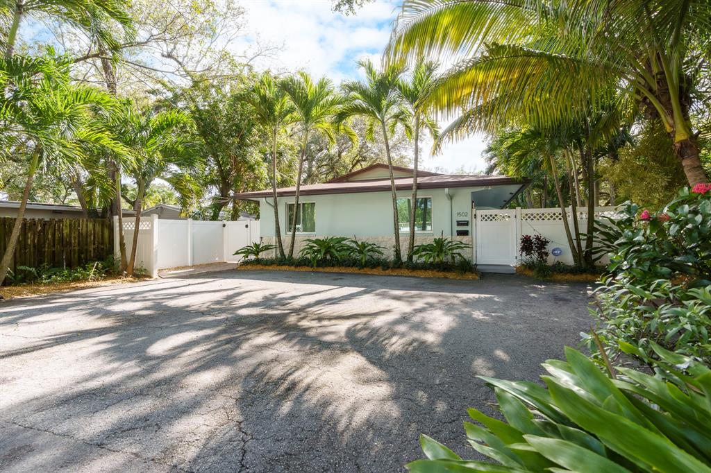 1502 Southwest 24th Street, Unit A Fort Lauderdale, FL 33315 - Photo 22 of 23 a front view of a house with a garden