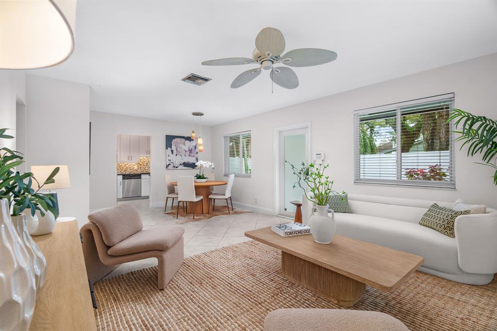 1502 Southwest 24th Street, Unit A Fort Lauderdale, FL 33315 - Photo 4 of 23 a living room with furniture and a large window