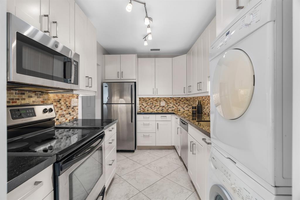 1502 Southwest 24th Street, Unit A Fort Lauderdale, FL 33315 - Photo 7 of 23 a kitchen with granite countertop a stove sink and refrigerator
