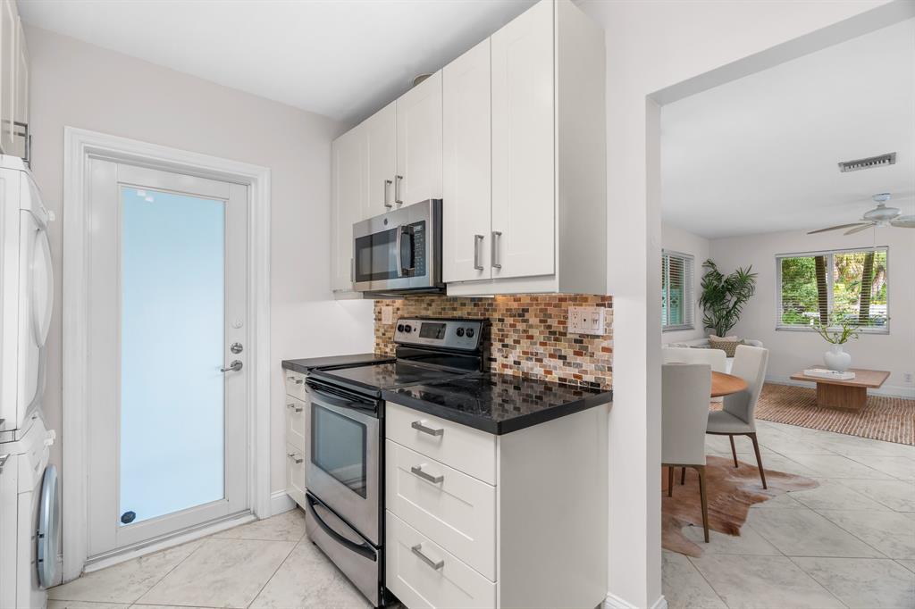 1502 Southwest 24th Street, Unit A Fort Lauderdale, FL 33315 - Photo 9 of 23 a kitchen with a stove and a refrigerator