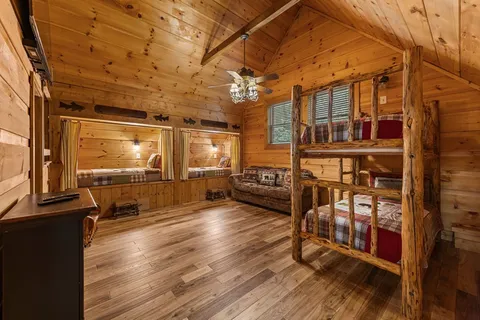 a view of a porch with wooden floor and a fireplace