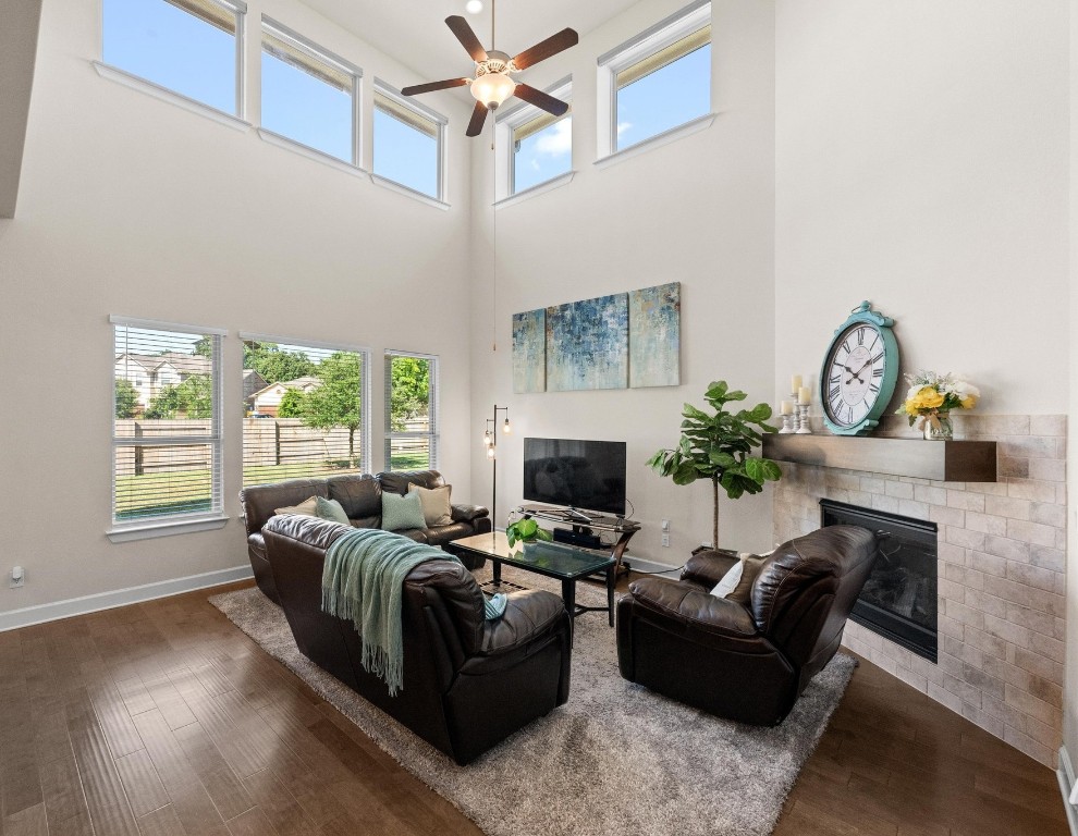 143 Pink Granite Boulevard Dripping Springs, TX 78620 - Photo 2 of 35 a living room with furniture a fireplace and a window