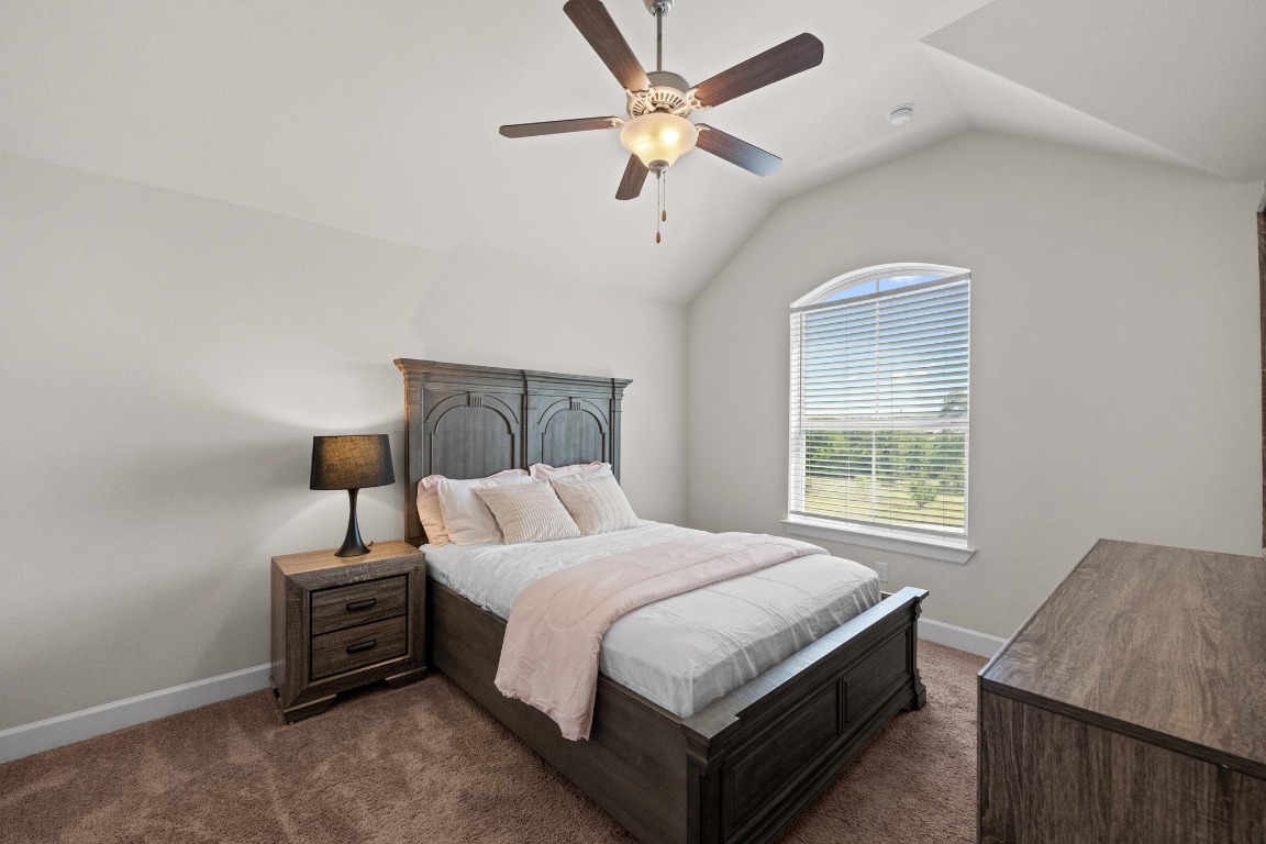 143 Pink Granite Boulevard Dripping Springs, TX 78620 - Photo 22 of 35 a bedroom with a bed and a window