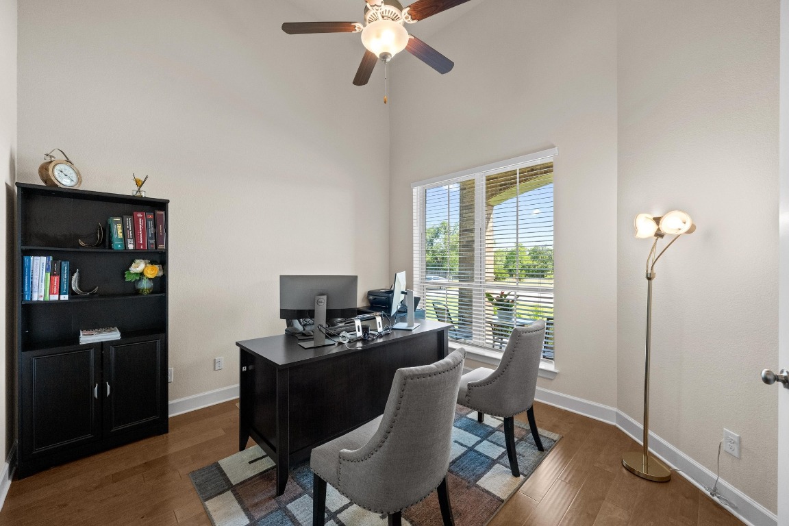143 Pink Granite Boulevard Dripping Springs, TX 78620 - Photo 7 of 35 a workspace with furniture hardwood and a window