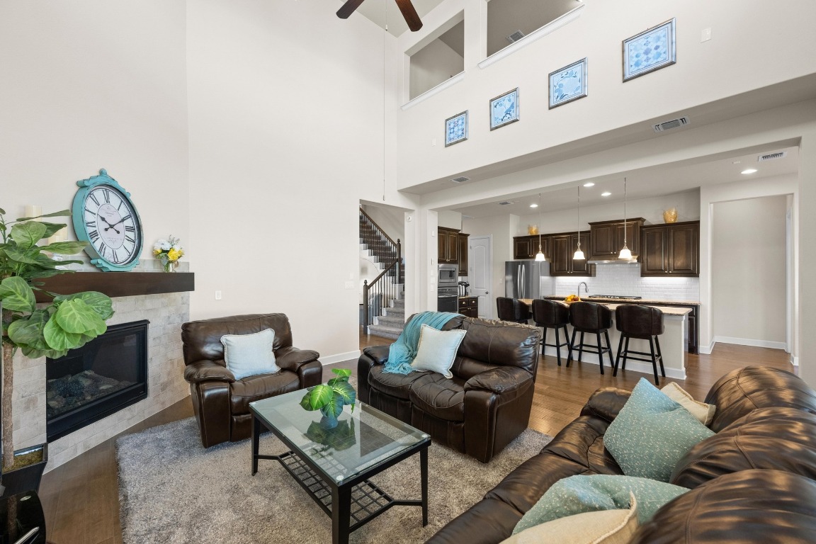 143 Pink Granite Boulevard Dripping Springs, TX 78620 - Photo 10 of 35 a living room with furniture and a fireplace