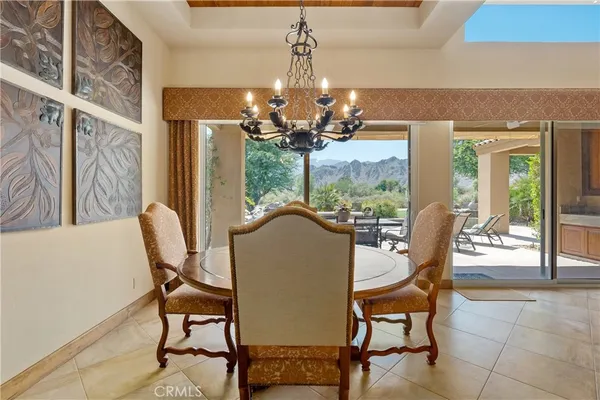 a kitchen with furniture a sink a counter and windows