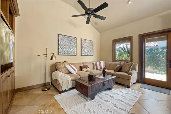 a spacious bedroom with two beds and a chandelier
