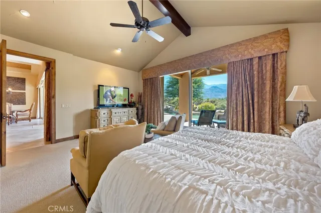a spacious bathroom with a bathtub double sink and mirror