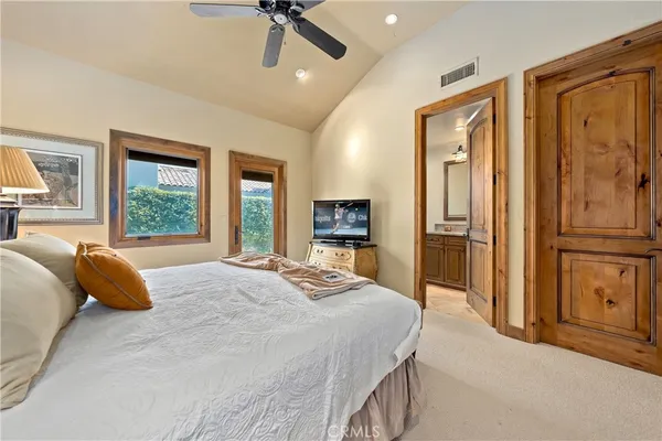 a view of a house with a yard and a garden