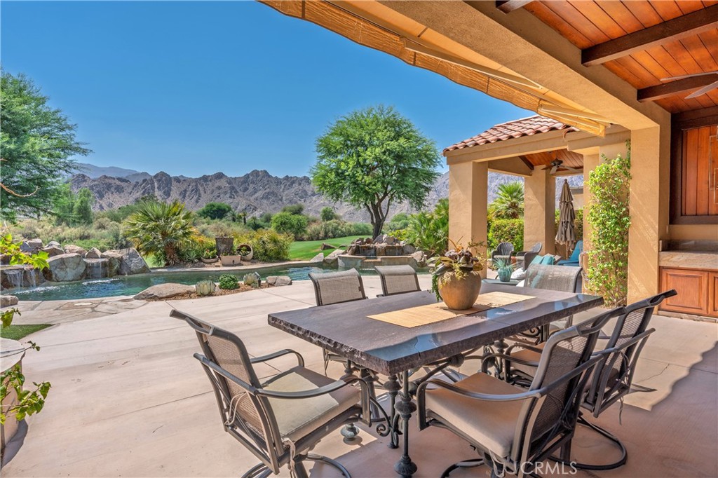 57205 Merion La Quinta, CA 92253 - Photo 44 of 55 a view of a patio with a table and chairs
