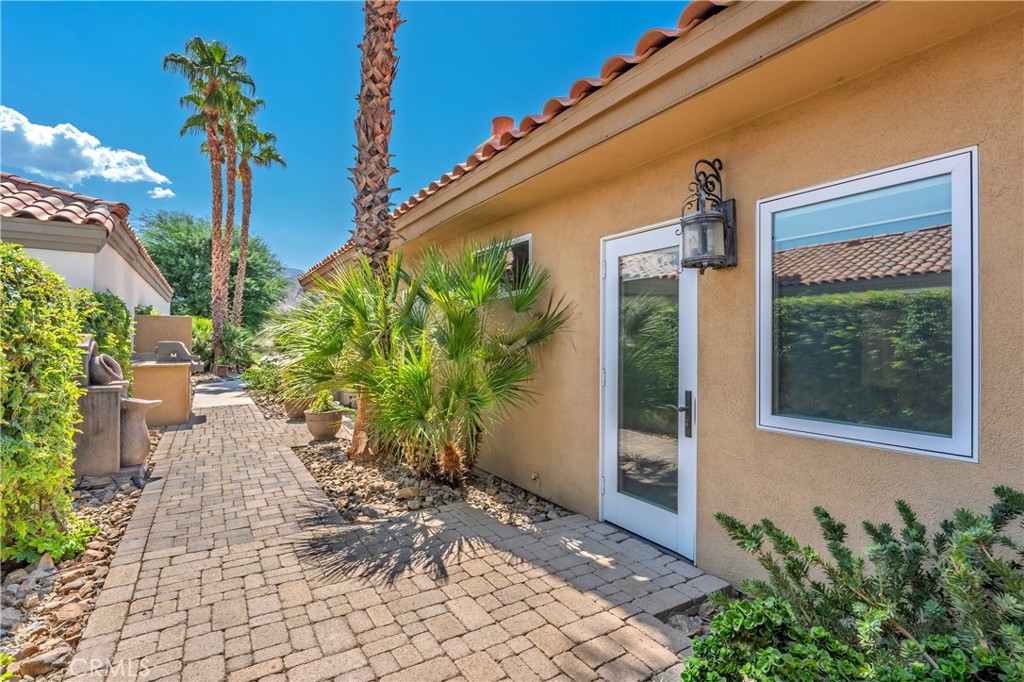 57205 Merion La Quinta, CA 92253 - Photo 48 of 55 a front view of a house with a yard