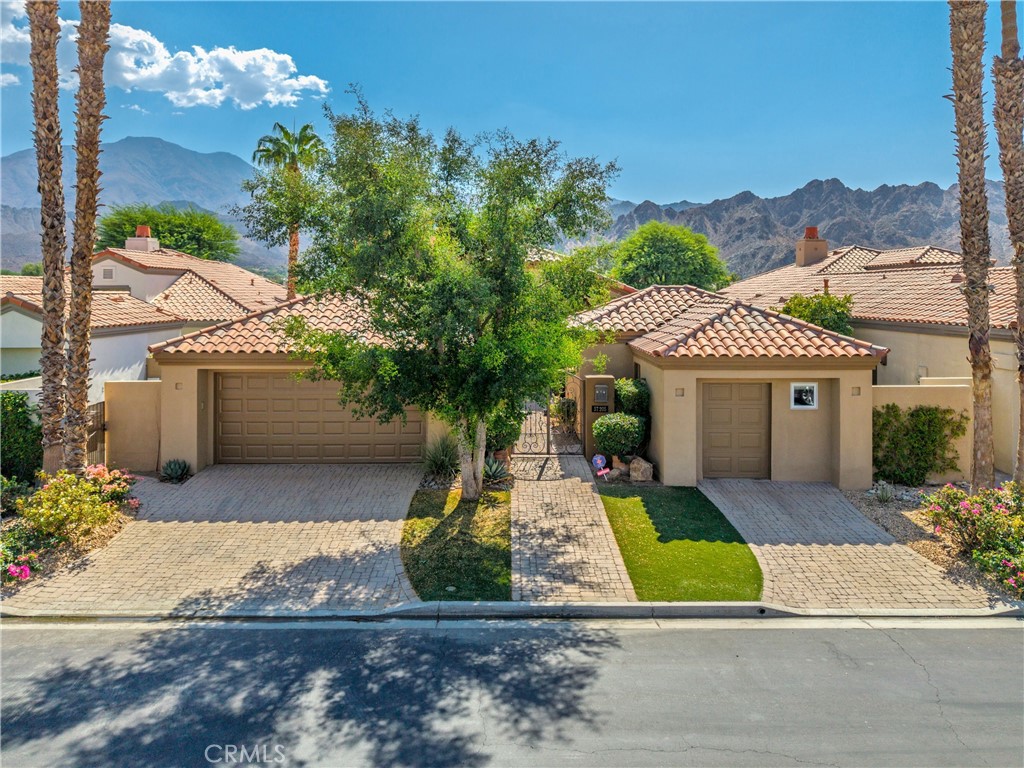 57205 Merion La Quinta, CA 92253 - Photo 55 of 55 a front view of a house with a yard and garage