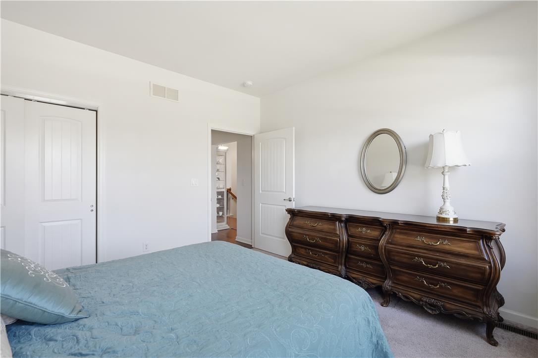 4120 Eveningstar Road Emmaus, PA 18049 - Photo 34 of 62 A well-lit bedroom offers plush carpeting and convenient closet access.