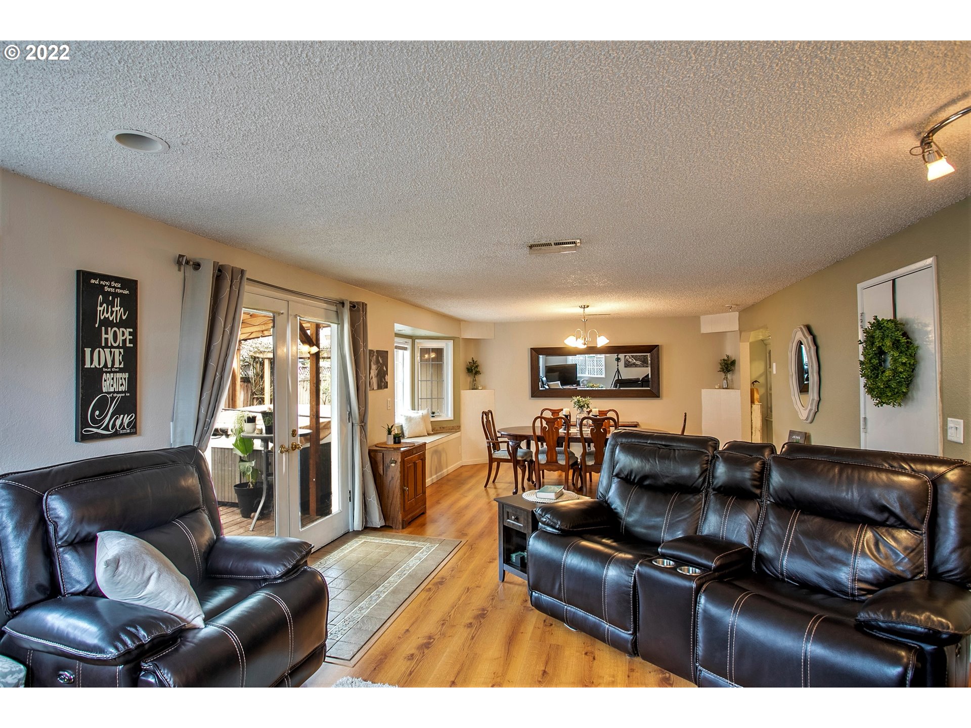 6305 C Street Springfield, OR 97478 - Photo 14 of 32 a living room with furniture a dining table and a piano
