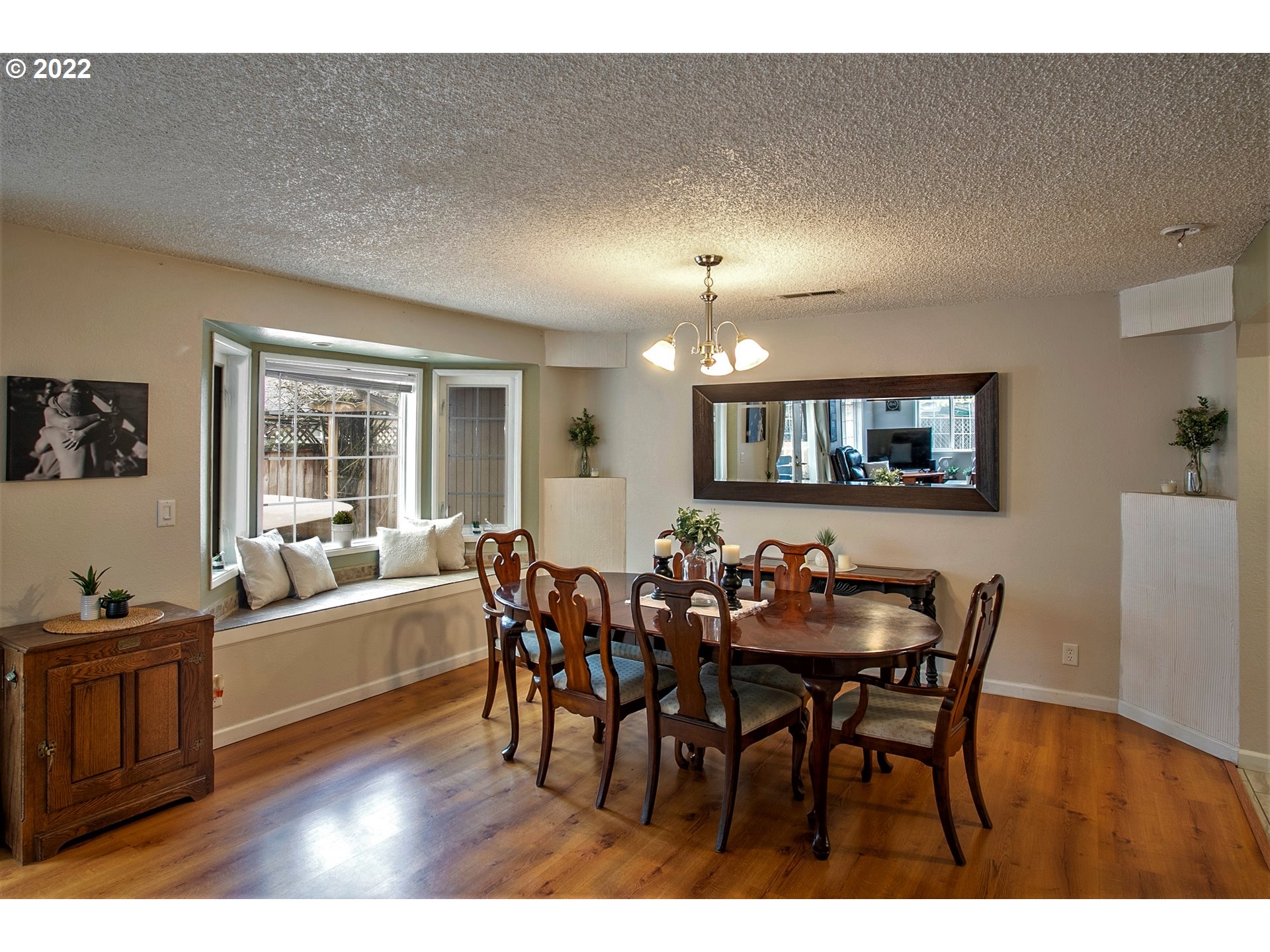 6305 C Street Springfield, OR 97478 - Photo 15 of 32 a view of a dining room with furniture and wooden floor