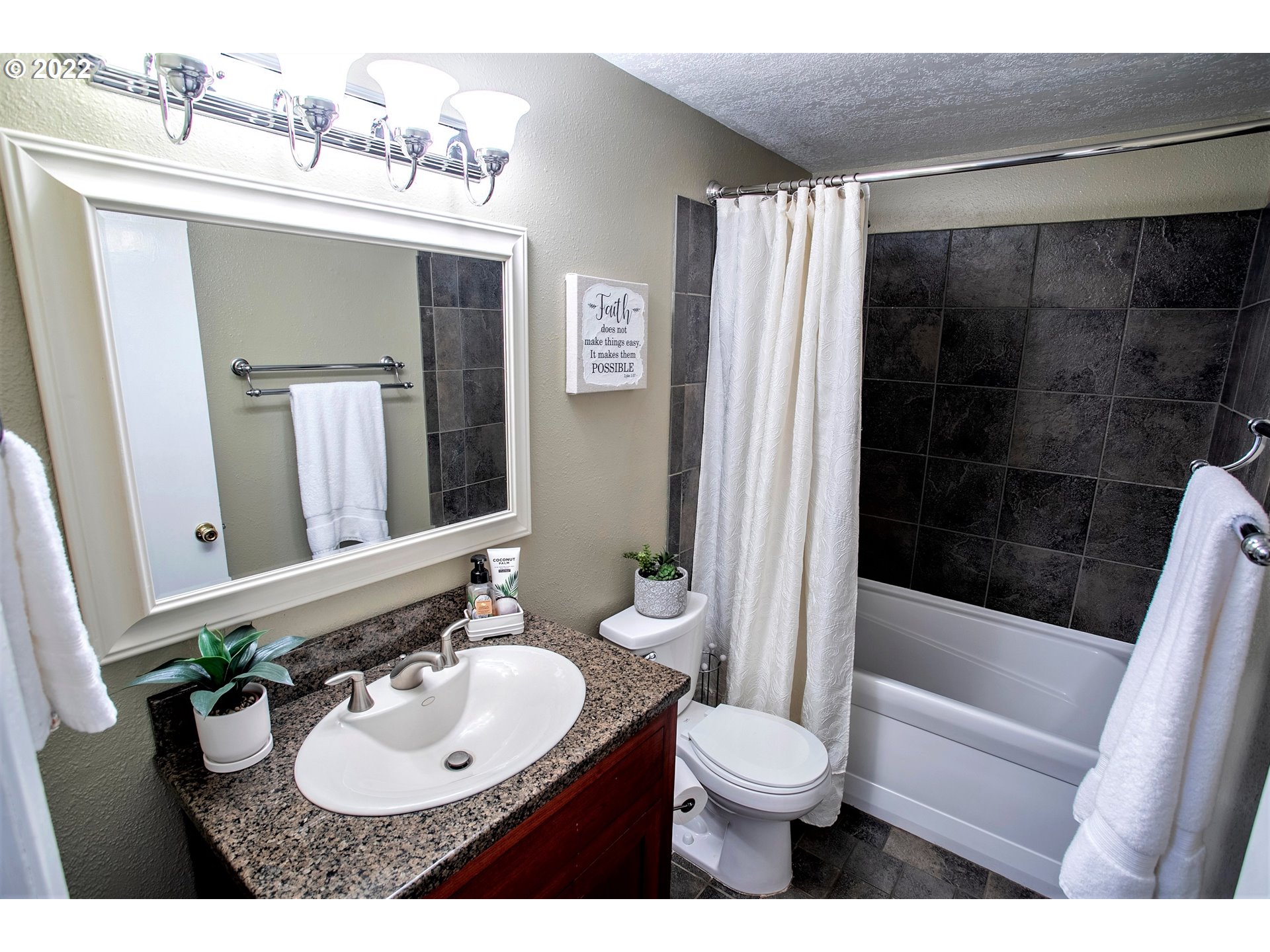 6305 C Street Springfield, OR 97478 - Photo 17 of 32 a bathroom with a sink toilet and shower
