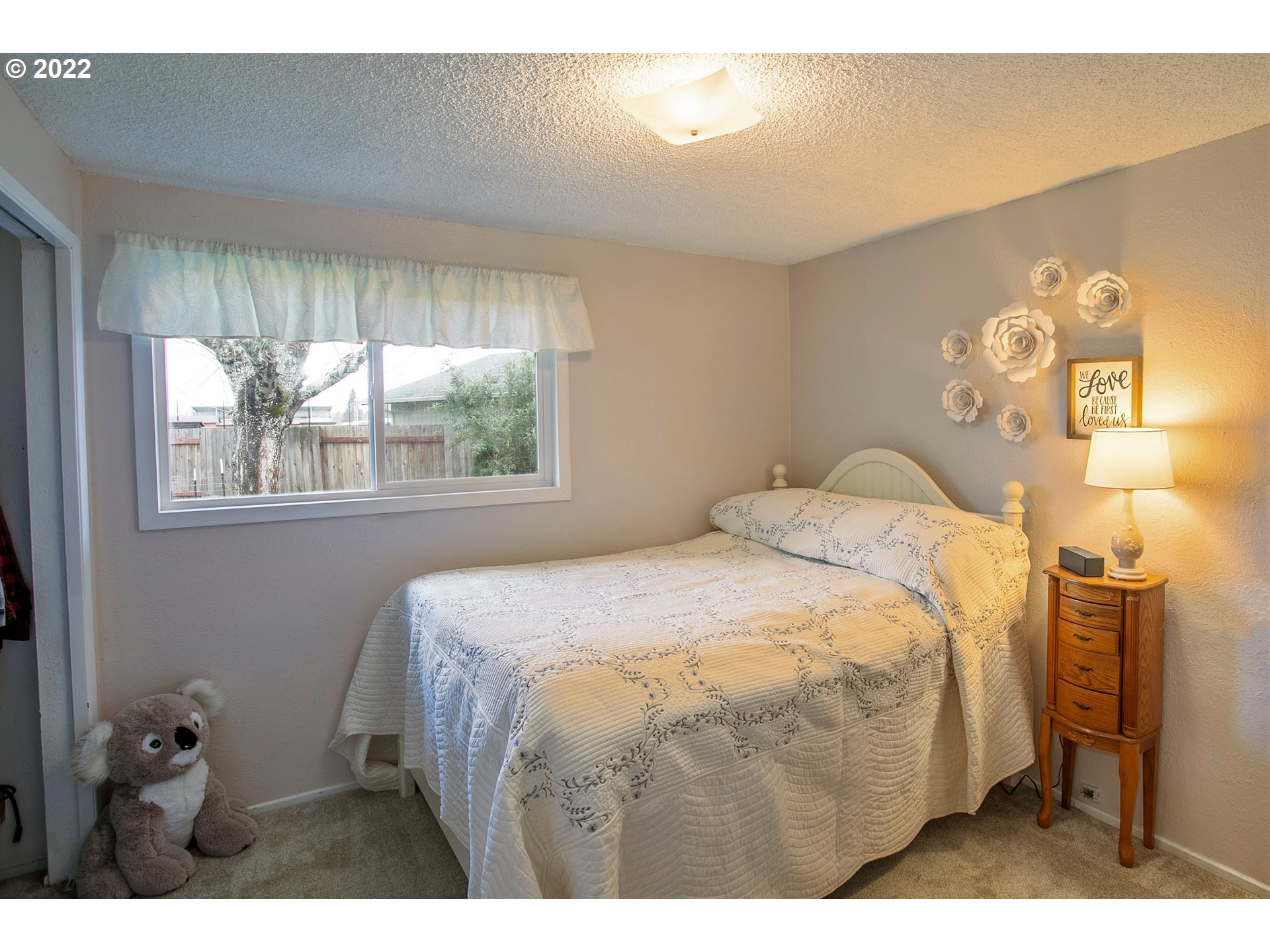 6305 C Street Springfield, OR 97478 - Photo 18 of 32 a bedroom with a bed and a window