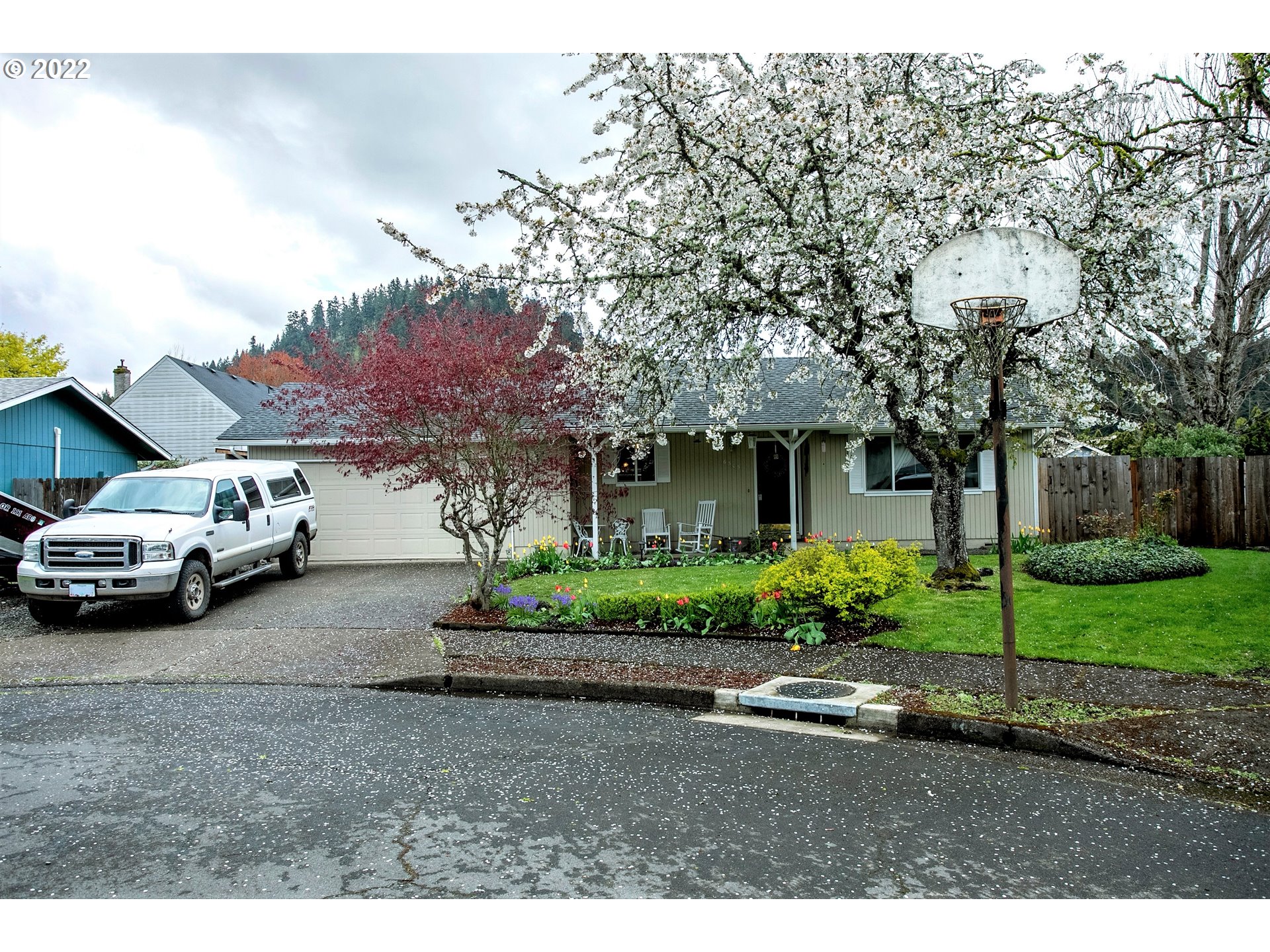 6305 C Street Springfield, OR 97478 - Photo 2 of 32 a view of a car parked in front of a house