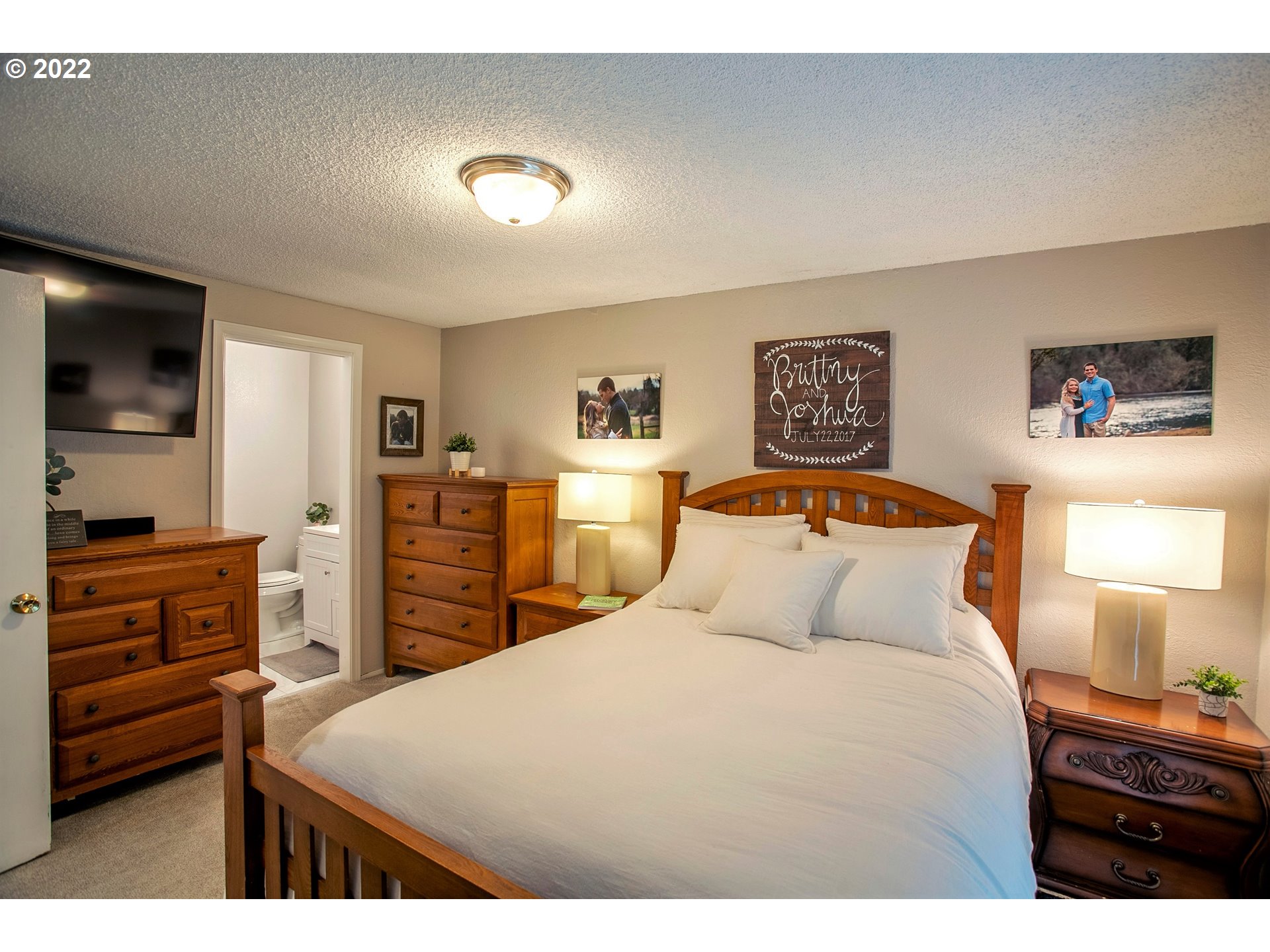 6305 C Street Springfield, OR 97478 - Photo 24 of 32 a bedroom with a bed and a flat screen tv