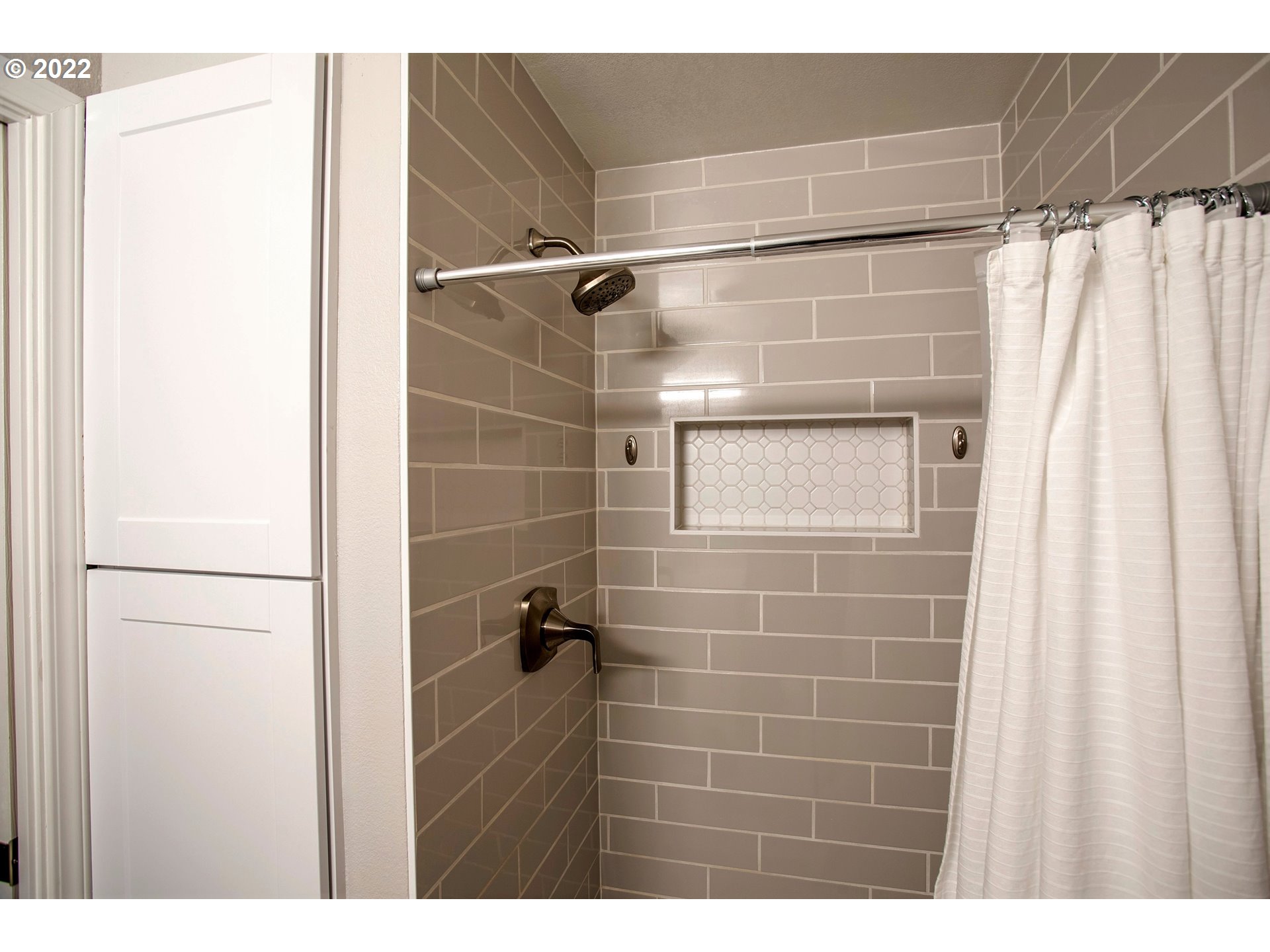 6305 C Street Springfield, OR 97478 - Photo 26 of 32 a bathroom with a shower and a sink