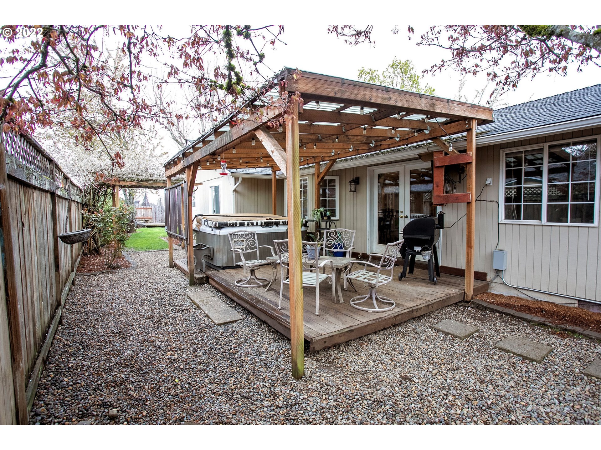 6305 C Street Springfield, OR 97478 - Photo 27 of 32 a view of a house with backyard porch and sitting area