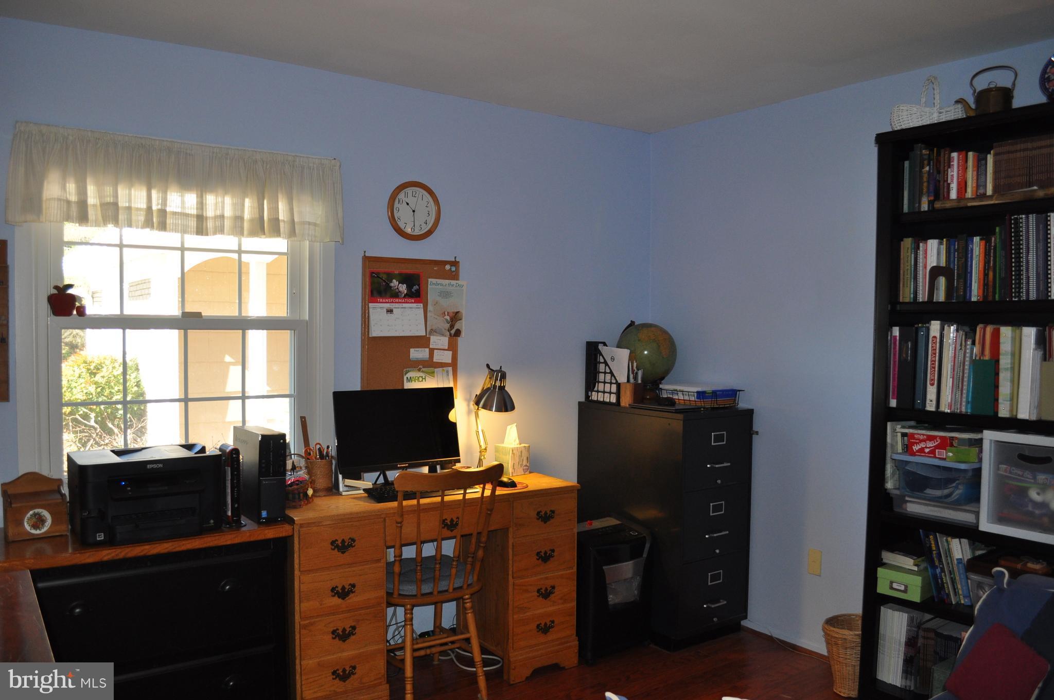 5159 Downwest Ride Columbia, MD 21044 - Photo 18 of 23 a view of a workspace with furniture and a window
