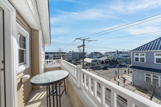 a balcony view with couple of chairs